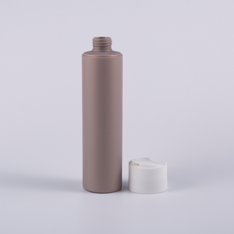 ディスク キャップが付いている複数の色のソフト タッチの円形の 250 ml のクレンジング ボトル